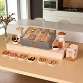 The Regal Treat Box festive gift hamper with assorted sweets, plain cashews, almonds, and premium tea jar, ideal for elegant celebrations.